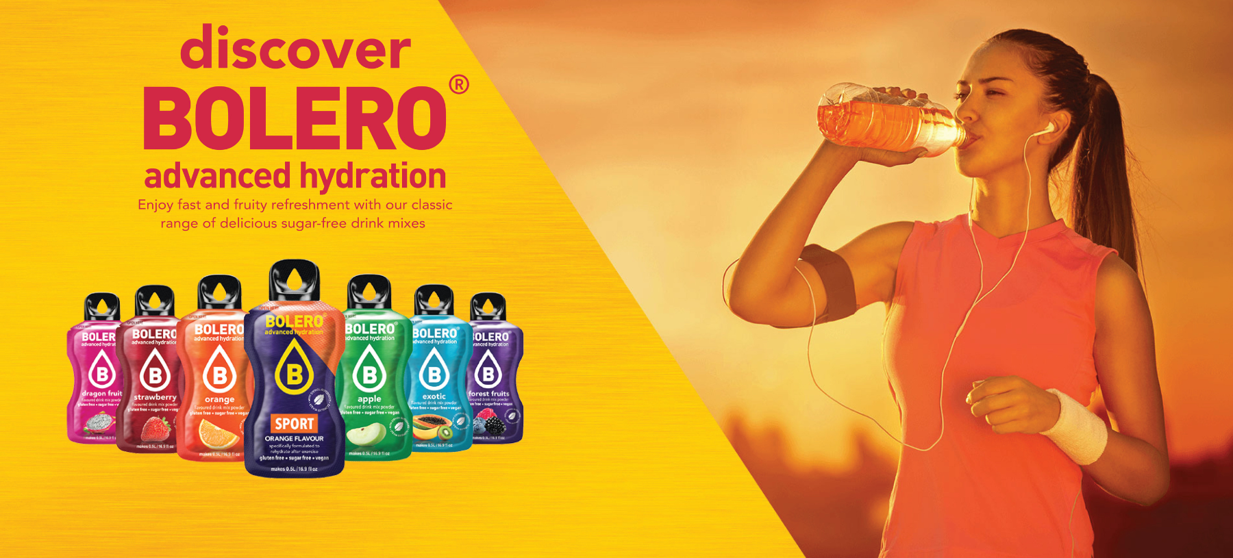 woman wearing an orange tank top with her hair in a ponytail drinking an orange drinking at sunset